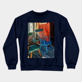 Blue and Green Rocking Chairs Against Red Door Crewneck Sweatshirt